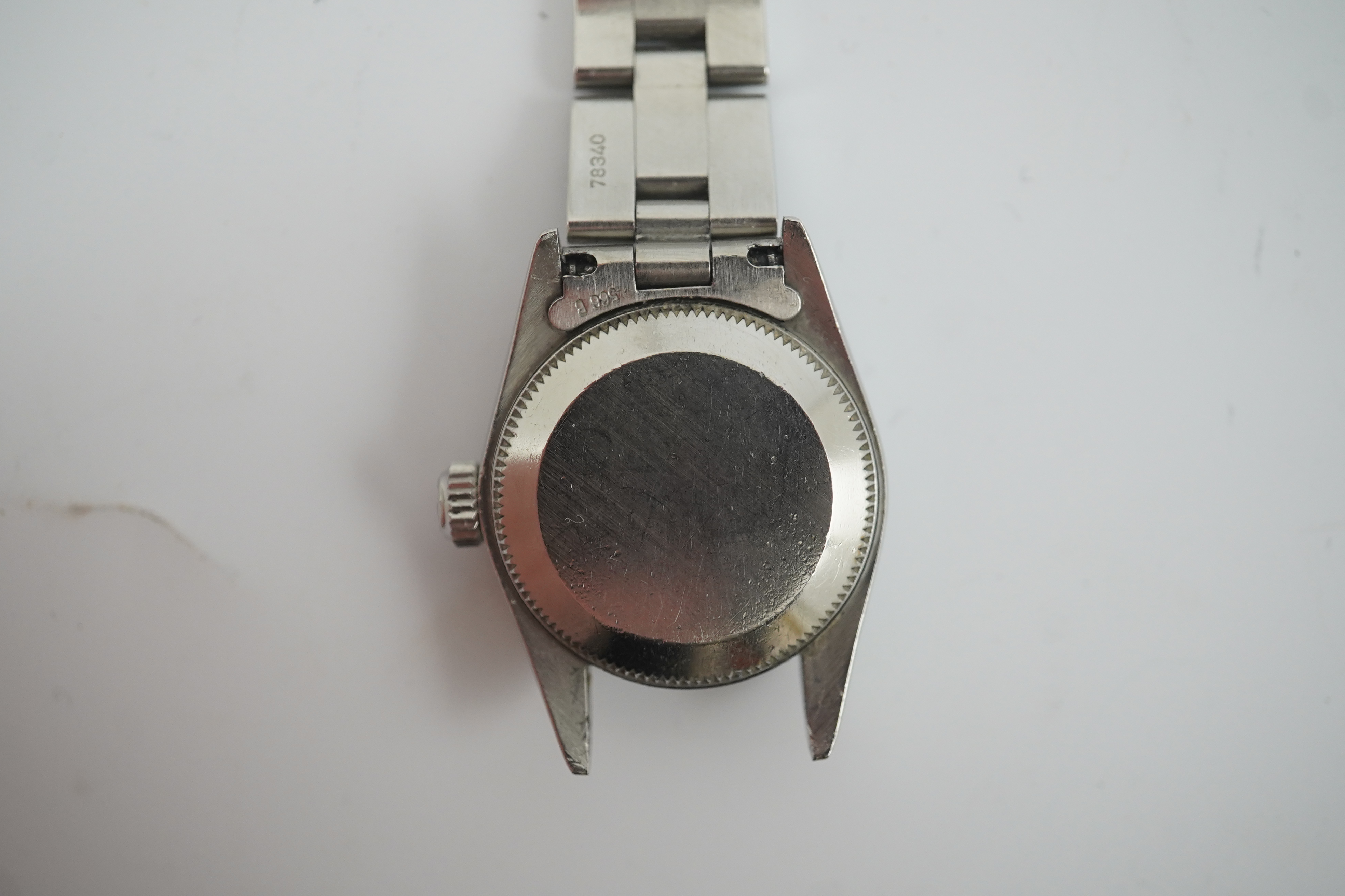 A lady's 1990's stainless steel Rolex Oyster Perpetual wrist watch, on a stainless steel Rolex bracelet